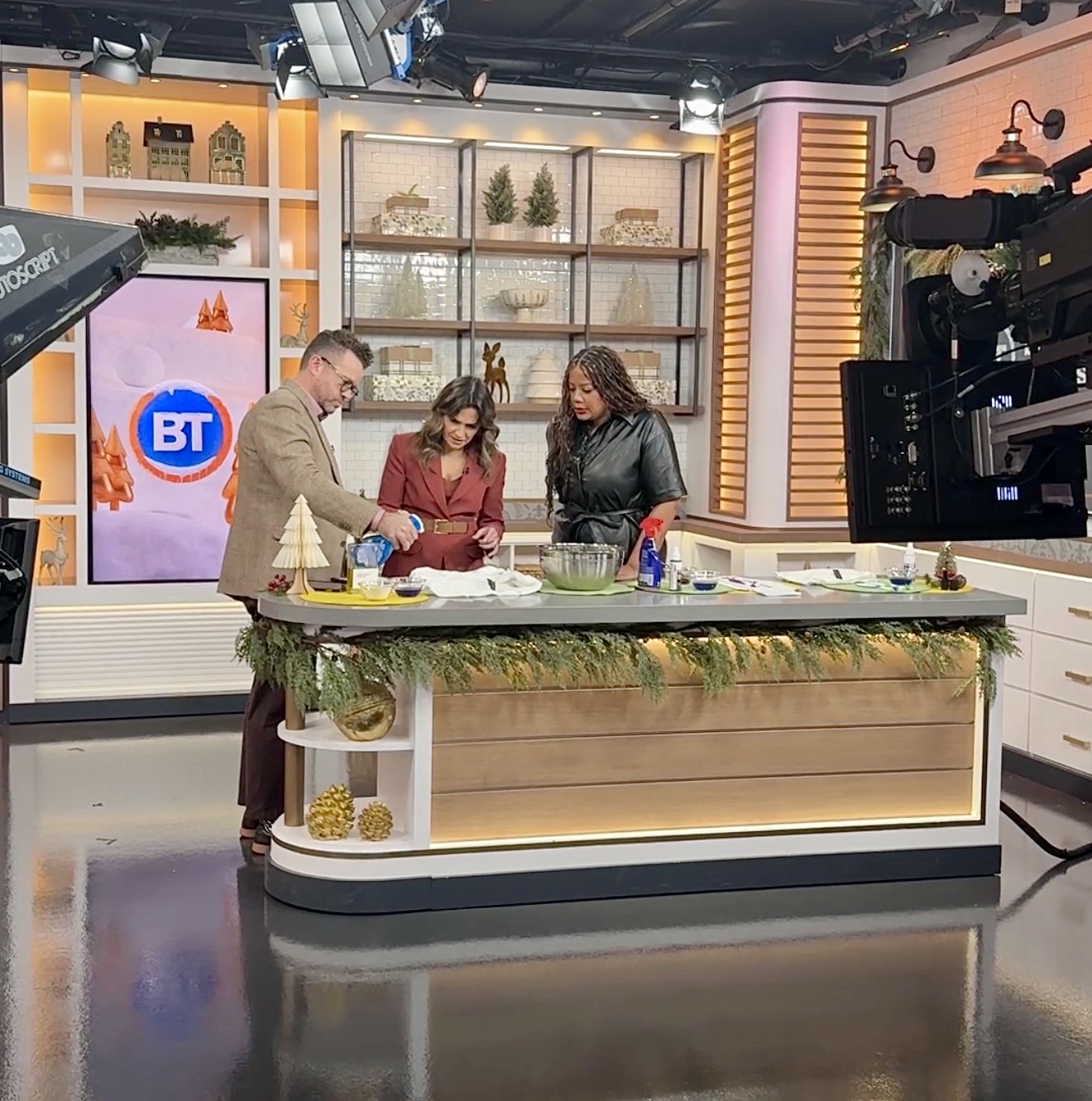 Three people on the set of Breakfast Teleivision