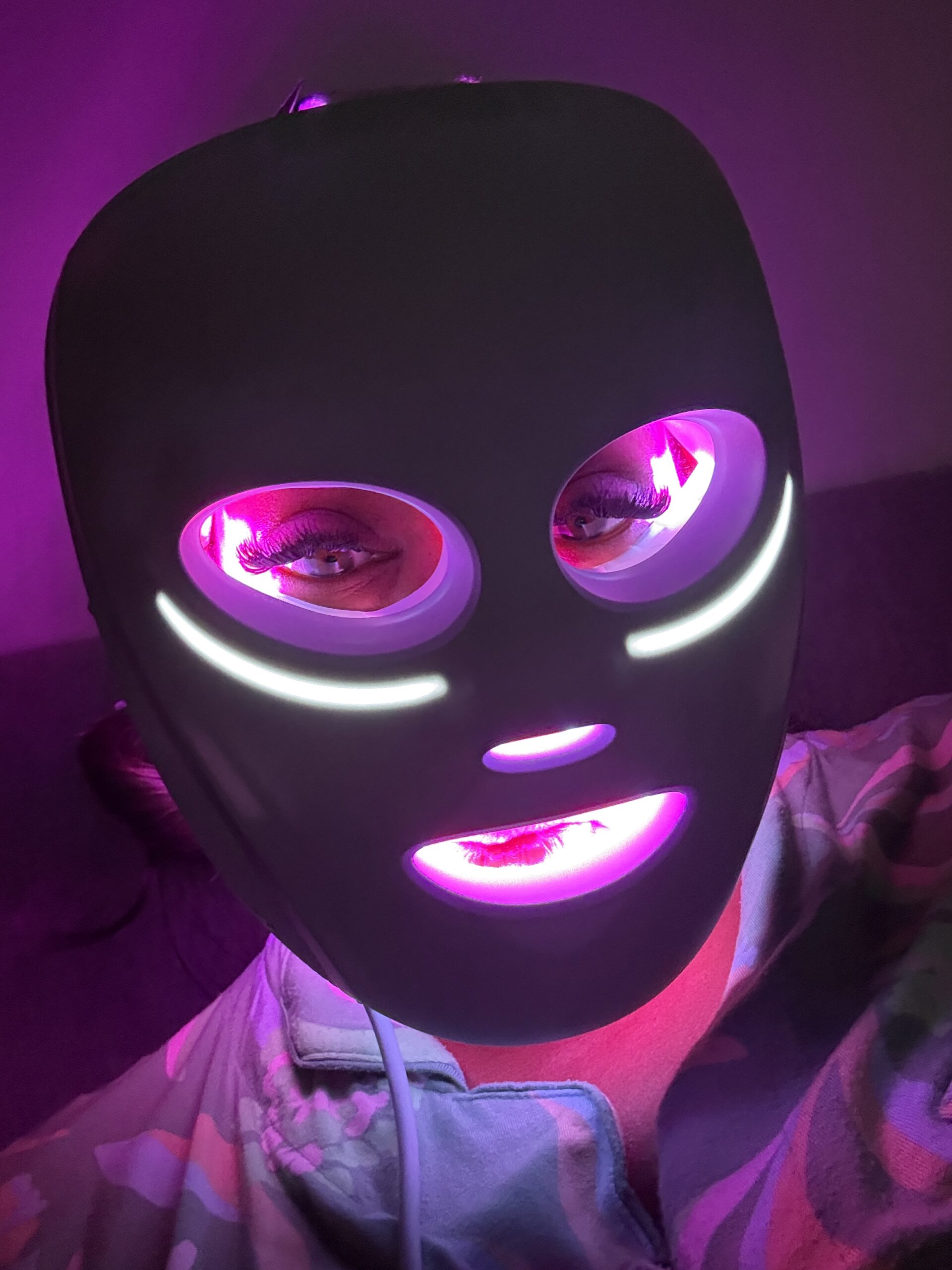 Lori using the Shark Cryoglow LED face mask during the Glow Skin Sustain treatment.